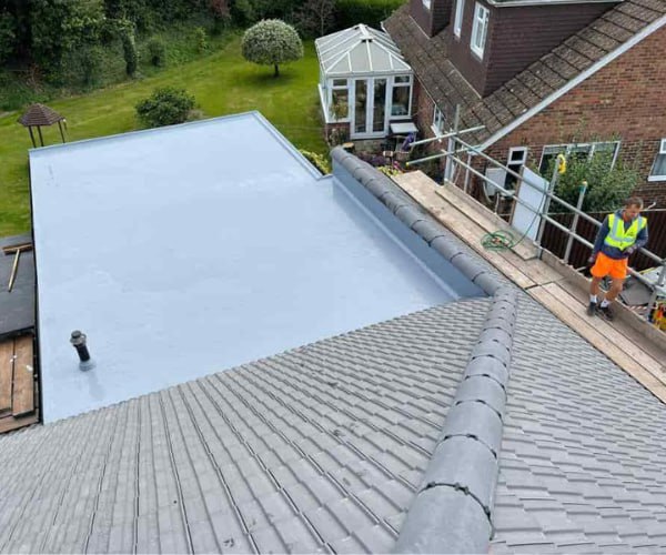 This is a photo of a newly installed hip roof, with a combined liquid covered flat roof. Work carried out by TVB Roofing Wellingborough